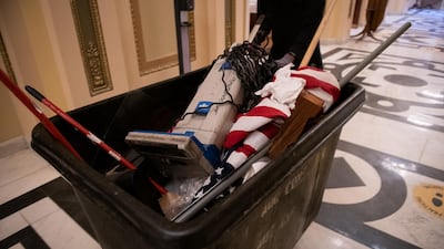 A worker pushes a trash bin at the US Capitol building in Washington. Bloomberg
