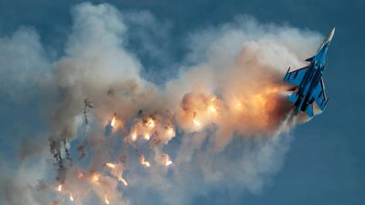A Sukhoi Su-30SM fighter jet of the Russian Knights aerobatic team performs a stunt at an airbase outside Moscow. Andrey Volkov / Reuters