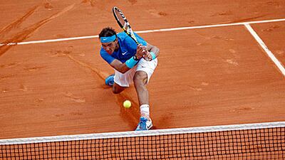 Rafael Nadal in full flow at the Roland Garros centre court on his way to a 7-5, 7-6, 5-7, 6-1 win.