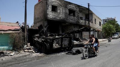 A burnt-out military vehicle after deadly clashes between Druze fighters, Sunni Bedouin tribes and government troops, in Sweida, Syria, last month. Reuters