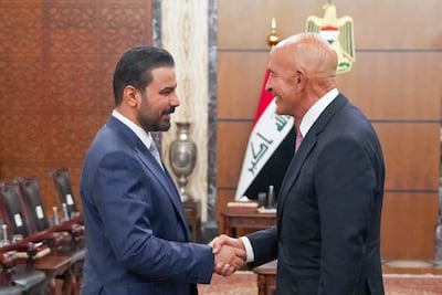 Mr Al Zaidi, left, and Mr Barrack said they had discussed 'the shared aspirational vision for the Iraqi government to build a brighter future free from terrorism'. AFP