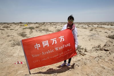 A Chinese investor poses for a picture on land in the Omani port town of Duqm where an industrial city, including an oil refinery, is due to be built following an economic agreement in 2016. Mohammed Mahjoub / AFP