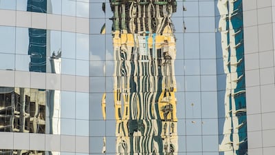 The exterior of Banque Saudi Fransi is shown in Riyadh, Saudi Arabia. The bank reported a 4.4% decline in second-quarter profits on higher Islamic tax provisions. Waseem Obaidi/The National.