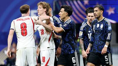 England midfielder Elliot Anderson is held back by teammate Anthony Gordon as he clashed with Argentina's Lisandro Martinez, Cristian Romero, Lionel Messi, and Leandro Paredes. Reuters