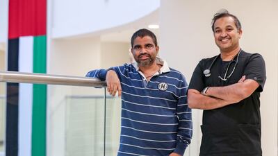 Dr. Niyas Khalid with his patient Nitesh Sadanand Madgaocar, 42, who beat a deadly bacterial infection at Burjeel Medical City. Khushnum Bhandari / The National