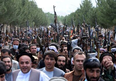 Hundreds of armed men gather to announce their support for Afghan security forces and that they are ready to fight against the Taliban, on the outskirts of Kabul, June 23. Reuters