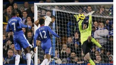 Jermaine Beckford heads past Petr Cech in the Chelsea goal to earn Everton a point. Kirsty Wigglesworth / AP Photo