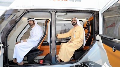 Sheikh Mohammed bin Rashid, Vice President and Ruler of Dubai, reviews two models of the Sky Pods at the World Government Summit.