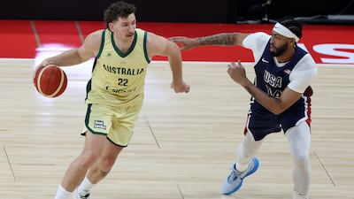 Anthony Davis of USA, right, takes on Will Magnay of Australia.