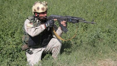 An Afghan security force takes position near the main prison building after an attack in Ghazni. Rahmatullah Alizadah / AFP Photo