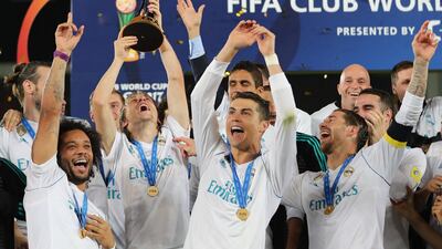 Real Madrid's Marcelo, Luka Modric, Cristiano Ronaldo and Sergio Ramos celebrate with the Fifa Club World Cup trophy. AFP