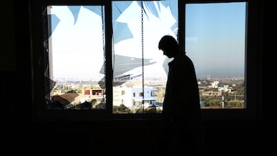 An Iraqi Kurdish man inspects the damage inside a home following an overnight attack on the city of Erbil. EPA