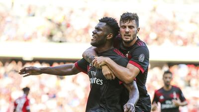 Frank Kessie celebrates a goal with teammate Patrick Cutrone during AC Milan's 4-0 pre-season win over Bayern Munich in China. Lintao Zhang / Getty Images