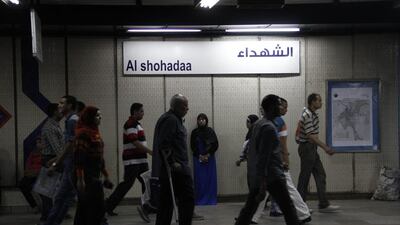 Egyptians make their way through Al Shohadaa (Martrys) metro station.