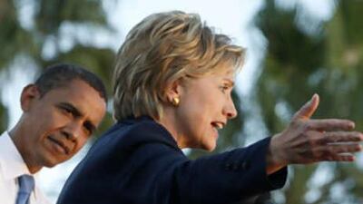 The US President-elect Barack Obama and Senator Hillary Clinton attend a campaign rally in Orlando, Florida, on Oct 20 2008. Mr Obama is said to be considering Mrs Clinton for the position of secretary of state.