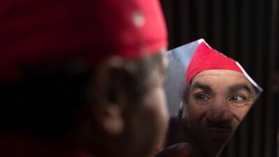 Belhussein Abdelsalam, applies make-up to transform himself into silent movie legend Charlie Chaplin's Little Tramp character. He hit upon the idea after seeing Chaplin on television. AP Photo