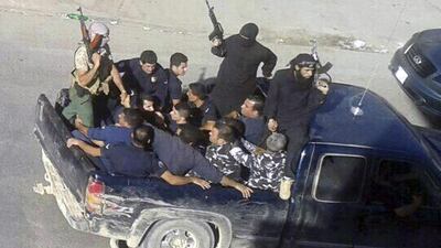 File picture taken on August 2, 2014 of gunmen driving away with about a dozen men in Arsal, a Sunni Muslim town near the Syrian border in eastern Lebanon. The ISIL threat first came to Lebanon in August, two months after the group’s summer blitz in which it seized large swaths of territory in Iraq and Syria. AP Photo