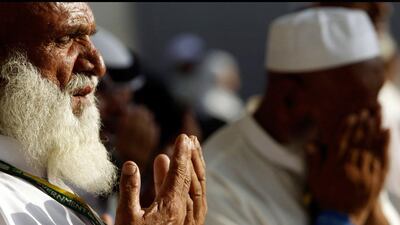Pilgrims pray after casting seven stones at a pillar that symbolises Satan, during the annual Haj pilgrimage on the second day of Eid al-Adha in Mina, near the holy city of Mecca. Amr Abdallah Dalsh / Reuters
