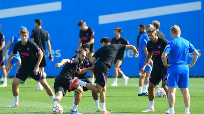Barcelona's Oscar Mingueza, centre left, Eric Garcia at the Joan Gamper training ground on Tuesday, September 28. AFP