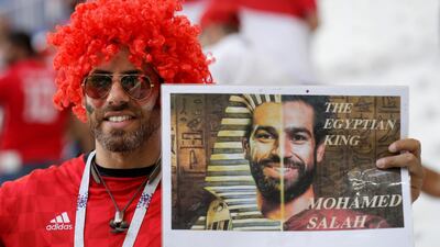 An Egypt fan holds a poster supporting Egypt's Mohamed Salah prior to the group A match between Saudi Arabia and Egypt. Andrew Medichini / AP Photo