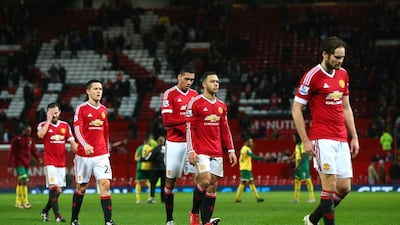 Manchester United players leave the pitch after their team’s 1-2 defeat in the Barclays Premier League match between Manchester United and Norwich City at Old Trafford on December 19, 2015 in Manchester, England. (Photo by Alex Livesey / Getty Images)