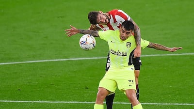 Atletico Madrid's Argentinian forward Angel Correa vies with Athletic Bilbao's Spanish defender Unai Nunez. AFP
