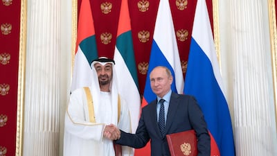 Sheikh Mohammed bin Zayed, Crown Prince of Abu Dhabi and Deputy Supreme Commander of the UAE Armed Forces (left) and Vladimir Putin, President of Russia (right), stand for a photograph after the signing of a memorandum of understanding, at the Kremlin Palace. Mohamed Al Hammadi / Crown Prince Court - Abu Dhabi