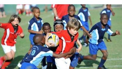 Children start playing rugby from seven, and from age eight they play full-contact, with modified rules for safety.