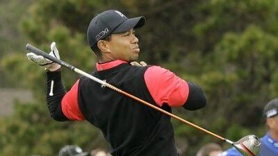 Tiger Woods lets go of his club after hitting from the 10th tee at Pebble Beach Golf Links during the final round of the AT&T Pebble Beach National Pro-Am golf tournament in Pebble Beach, Calif., Sunday, Feb. 12, 2012. (AP Photo/Eric Risberg) *** Local Caption *** Pebble Beach Golf.JPEG-04ac4.jpg