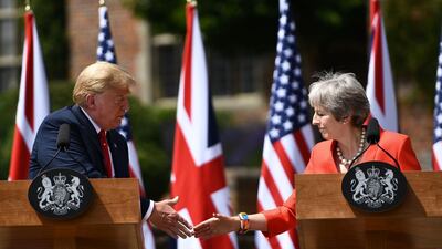US president Donald Trump, left. and Britain's prime minister Theresa May shake hands at a press conference following their meeting at Chequers, the prime minister's country residence, near Ellesborough, northwest of London. Brendan Smialowski / AFP Photo