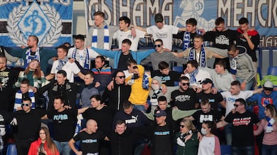 Fans cheer as they watch FC Minsk and FC Dinamo-Minsk. EPA