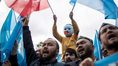 Turkish and Uighur protesters shout slogans as they hold flags during a protest against China after prayers at Fatih Mosque in Istanbul, Turkey, 06 November 2018. EPA
