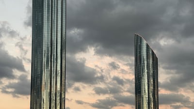 A cloudy winter sky reflected in the World Trade Centre towers in Abu Dhabi. The National