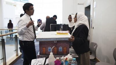 Ameena Shafi and Hessa Chalukunnan explain the idea behind their Child Detector invention at the Gems Singularity University Global Innovation Challenge. Anna Nielsen for The National