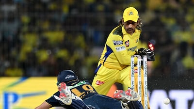 Chennai Super Kings' wicketkeeper MS Dhoni attempts to stump out Gujarat Titans' David Miller. AFP