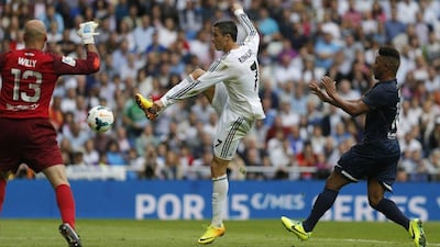 Cristiano Ronaldo scored a spot kick in stoppage time on Saturday for Real Madrid. Andres Kudacki / AP