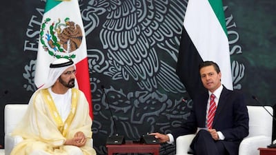 Sheikh Mohammed inspects the guard of honour with Mexican President, Enrique Peña Nieto. PRESIDENCIA / EPA