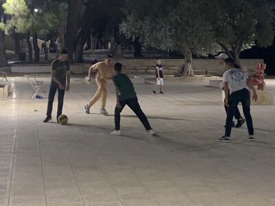 Young Palestinians play football on the plaza of Al Aqsa Mosque in Jerusalem. Hamza Hendawi / The National