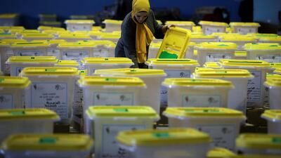 A Jordanian election official checks ballot boxes at a counting centre in Amman, Jordan ahead of parliamentary elections on November 10. Reuters