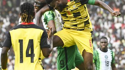 Ghana's Thomas Partey and Victor Osimhen challenge for a header. AFP