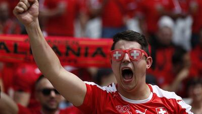 A Swiss supporter cheers for his team before the Uefa Euro 2016 group A preliminary round match between Albania and Switzerland at Stade Bollaert-Delelis in Lens Agglomeration, France, 11 June 2016. Laurent Dubrule / EPA