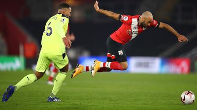 Jamaal Lascelles of Newcastle United (left) and Nathan Redmond of Southampton (right) in action during the English Premier League match between Southampton and Newcastle United in Southampton, Britain. EPA