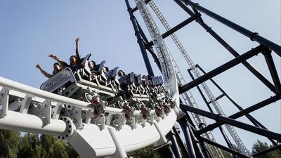 Above, visitors ride the Full Throttle roller coaster at Six Flags Magic Mountain in California. Patrick Fallon / Bloomberg
