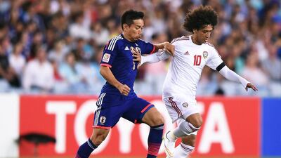 Yuto Nagatomo, left, of Japan in action against Omar Abdulrahman of the UAE during their Asian Cup quarter-final at Stadium Australia in Sydney on January 23, 2015. Paul Miller / EPA