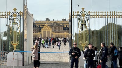 Tourists enter Versailles Palace after an evacuation order was lifted. Reuters