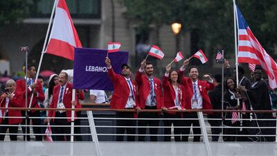 The Lebanese team parades along the Seine. AP