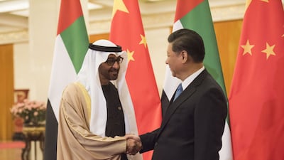 Sheikh Mohammed bin Zayed, Crown Prince of Abu Dhabi and Deputy Supreme Commander of the Armed Forces, shakes hands with Chinese president Xi Jinping at the Great Hall of the People in Beijing on December 14, 2015. AFP