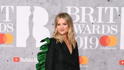Laura Whitmore channels a chic dinosaur in a jacket dress with directional frills. Photo: Getty