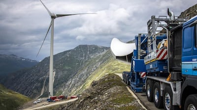 A wind turbine blade is transported to the Griessee lake site in,Valais, Switzerland. Each blade weighs about 11,000 kilograms. Olivier Maire / EPA