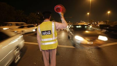 A police officer directs motorists at 30th and 19th Streets during last night's traffic chaos.